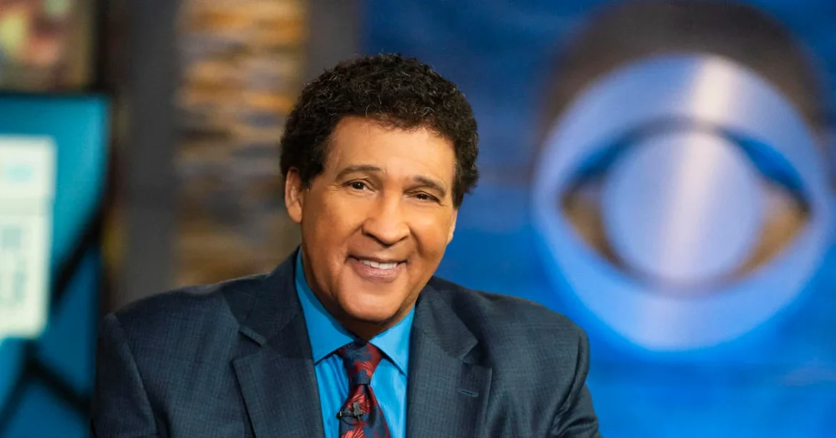 greg-gumbel-at-studio-desk-promo