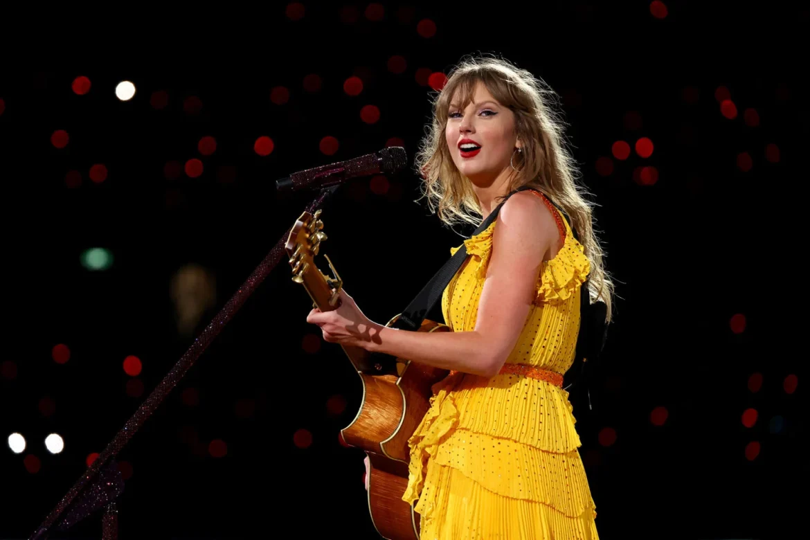 Taylor-Swift-concert-yellow-dress-GettyImages-2015112497-2400×1600-1-1500×1000